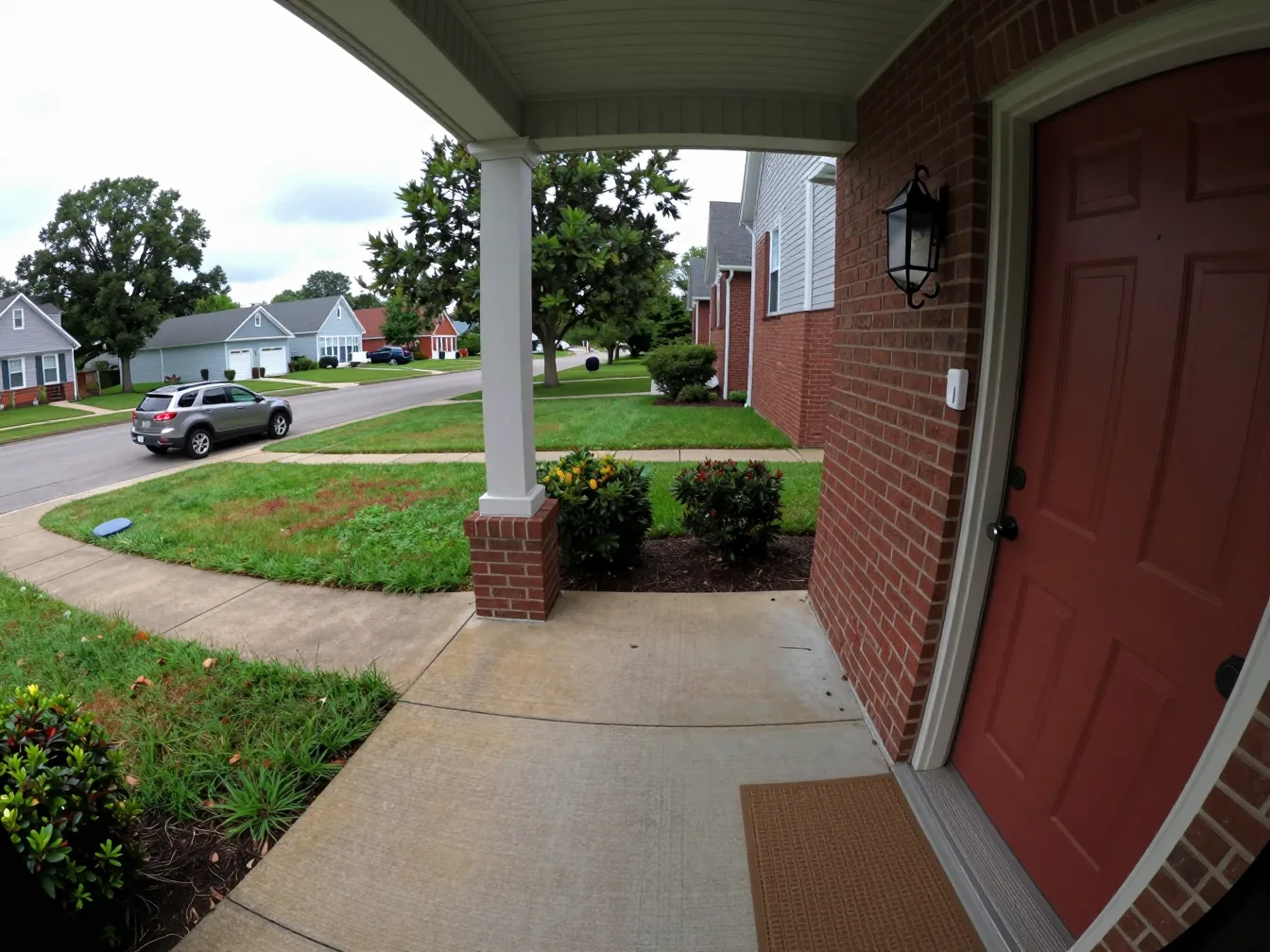 Front door security camera view of the porch